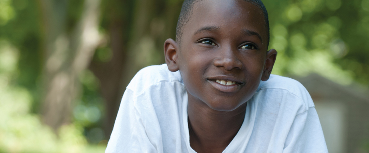 Boy in grass photo